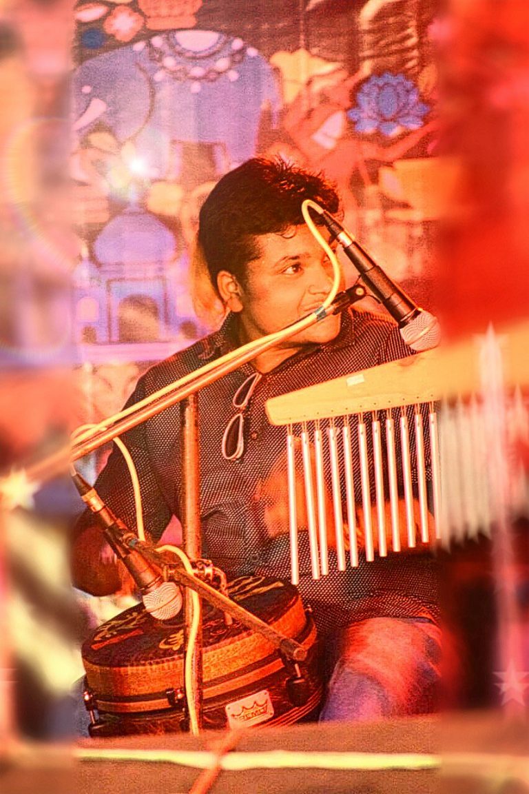 A man playing musical instruments in a musical event